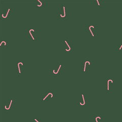 Bold and eye-catching seamless design with diagonally placed classic candy canes contrasted against a solid green background, excellent for merchandising.