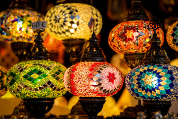 Christmas decoration with ornaments lights fir branches golden baubles red ribbons and festive details creating holiday atmosphere indoor seasonal design bright colorful winter celebration style scene