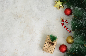 Festive Christmas Decorations with Gift and Ornaments on Textured Background blank space