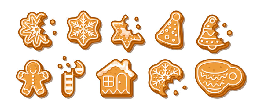 Collection of festive gingerbread cookies in various holiday shapes with white icing, isolated on white background