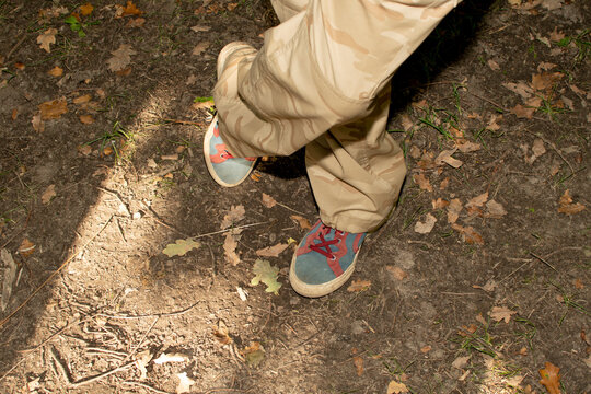 Man's feets in blue retro sneakers	