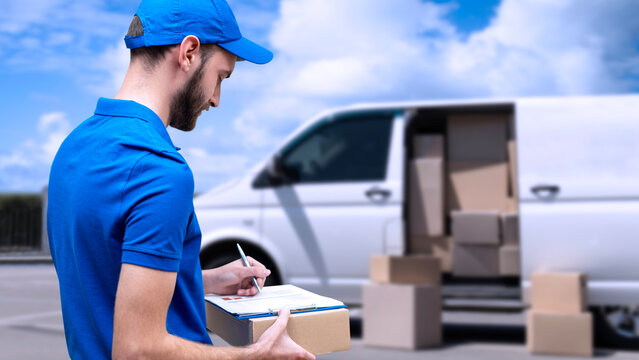delivery man carrying boxes to customer