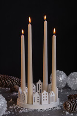 Natural Christmas essential oil, home aroma diffuser. Burning candles, branches of fir tree.