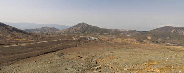 Panoramic view of of footwalk tot the crater of Mount Aso and Vulcano in Aso Kumamoto perfecture in Japan