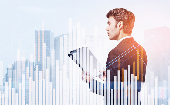 Man in suit studying documents with abstract financial charts overlay, modern city background, concept of finance, people, and data analysis