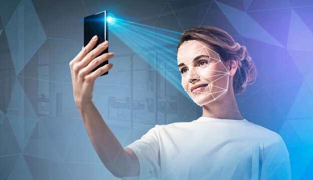 Woman holding smartphone with facial recognition scan, digital geometric overlay, modern office background, concept of biometric authentication and security