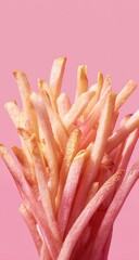 French fries tower on a vibrant pink background