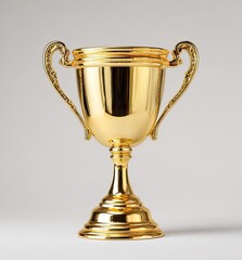 Gleaming golden trophy with ornate handles on a light background