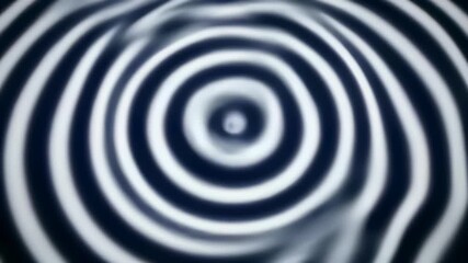 Concentric wave pattern of circular object against black and white background capturing the theme of cycles, patterns, or progression in various contexts from business strategy to personal.