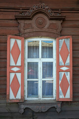 Window with shutters. Fragment of an old wooden house in the historical center of Irkutsk, Russia