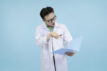 Frustrated Asian scientist or doctor in a lab coat, grimacing and pointing while holding a folder,...