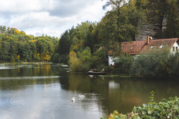 Peaceful lake with swans and countryside house, Czech Republic © Alexey Tarasov