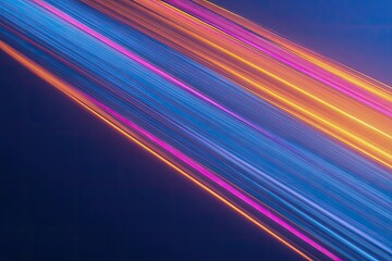 Angled abstract of glowing light trails in hues of blue, pink, and gold, dark background