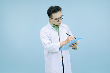 Confident Asian scientist or doctor in a lab coat and glasses, standing and  writing notes on a...