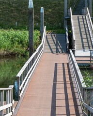 Obraz premium wooden bridge for pedestrians on the canal