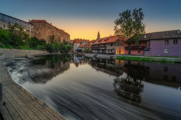 by the Vltava River at sunrise