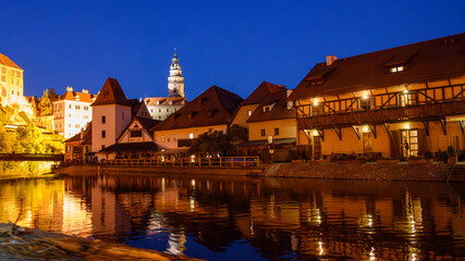 Naklejka premium Cesky Krumlov in the evening from a boat on the Vltava River