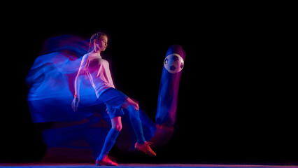 Football player performing ball control kick in colorful motion. Concept of football technique training, athletic movement design, sportswear promotion, and creative ad visuals.