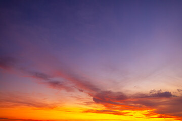 Orange sky and clouds in a bright morning,Orange clouds and morning sky,Real majestic sunrise sundown sky background with gentle colorful clouds without birds. Panoramic, big size.