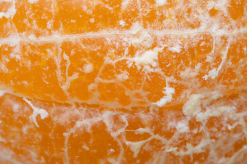 Close-up macro of orange flesh texture,Orange fruit juicy carpels or orange flesh close up. Macro shot of orange flesh structure.