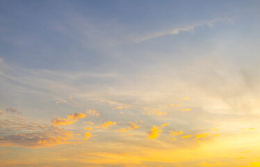 Orange sky and clouds in a bright morning,Orange clouds and morning sky,Real majestic sunrise sundown sky background with gentle colorful clouds without birds. Panoramic, big size.