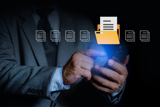 Man uses a smart phone to search data on the server. Document Management System DMS, online document database. Searching, and management of company files and data.