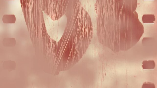 retro stylized letterforms on weathered film with artistic brushwork and perforations