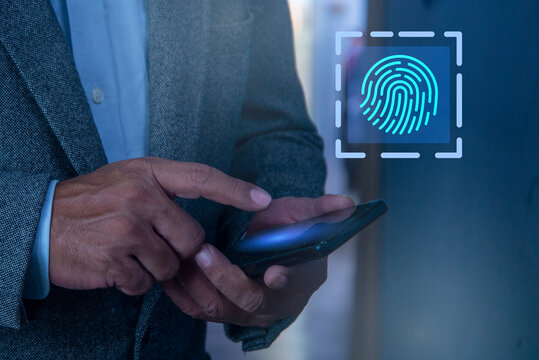 Man hand scanning fingerprint on smartphone screen, Unlock mobile phone, unlock the device, concept of fingerprint, biometrics, information technology and cyber security.