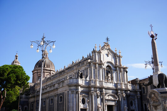 Catania Cathedral, Saint Agatha Cathedral, and ancient elephant statue made of lava stone, known as U Liotru in Piazza del Duomo in Catania, Sicily, Italy. Italian holidays. Sicilian travel. 