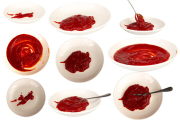 Ketchup splashing on a white plate on white background