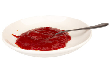 Ketchup splashing on a white plate spoon on white background