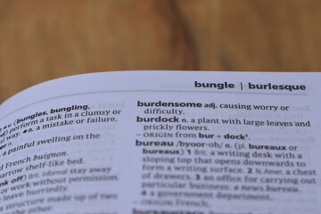 English Dictionary Page Close Up With The Word Meaning Of -burdensome
