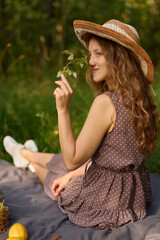 Quiet outdoor setting with woman writing and natural surroundings