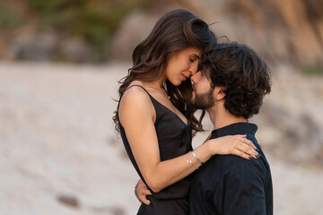 Intimate romantic couple hugging and touching foreheads