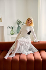 Woman laughing comfortably, Brighthaired lady relaxes happily