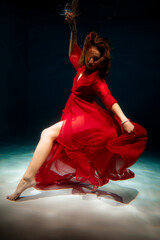 Underwater figure with flowing fabric creates mythic storytelling