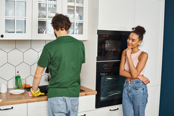 Enjoying cozy moments at home while sharing chores on a sunny afternoon