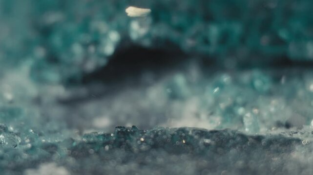 Axe Impact on Glass Pane with Shards Flying