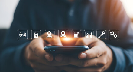 Person uses a smartphone with various app icons displayed including wifi location security fuel and settings showcasing mobile technology and connectivity for modern lifestyle applications and service