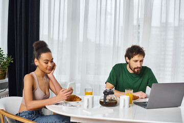 Cozy morning routine for a young couple enjoying breakfast at home