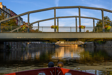 view of bridges and buildings in Ceske Budejovice from boat on the Vltava