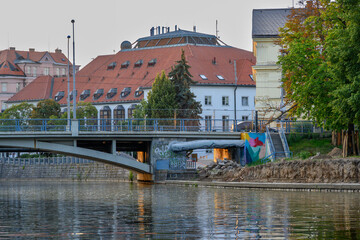 view of bridges and buildings in Ceske Budejovice from boat on the Vltava