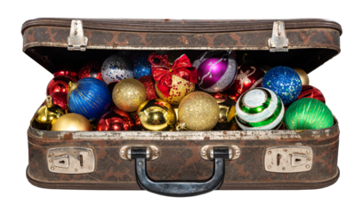 Old worn leather suitcase with New Year's toys on a white background.