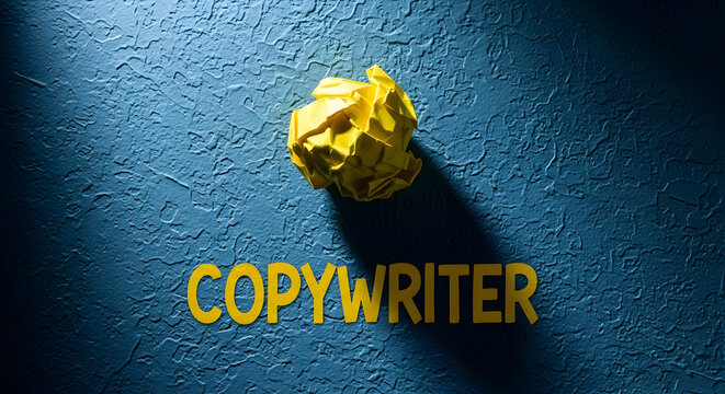 Yellow crumpled paper ball and the word copywriter on a textured blue background representing creative block writing process and the challenges of content creation and marketing strategies