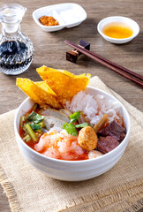 Yen Ta Fo noodles on a wooden table