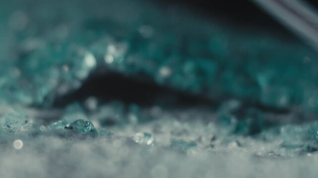 Macro of Screwdriver on Glass Debris in Workshop