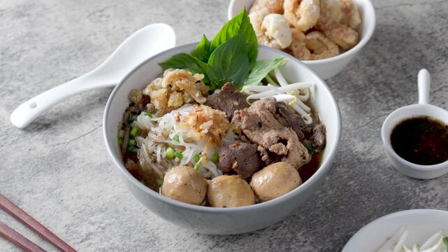 Boat noodles on a wooden table