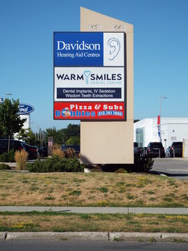  Gloucester, ON, Canada-June 26,2025:A tall, "vertical pylon sign" for a commercial plaza with unit numbers 1437 - 1443 visible at Ogilvie Rd.
