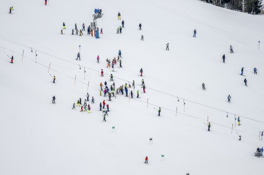 Ski lessons and many skiers on a ski slope with drag lift, view from above, Hochbrixen in winter, Skiwelt Wilder Kaiser Brixental, Tyrol, Austria
