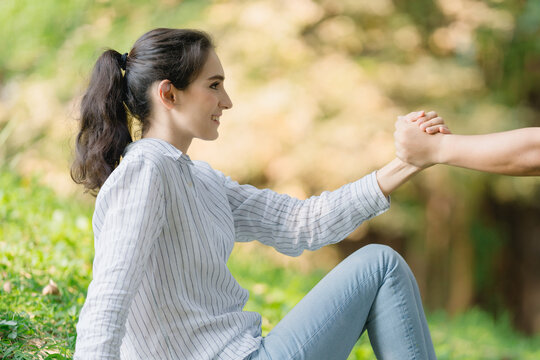 Professional woman and partner in motivational handshake, shared goal achievement, team strength, and challenge agreement outdoors
